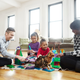 “Transgender dad plays with daughters in living room.”